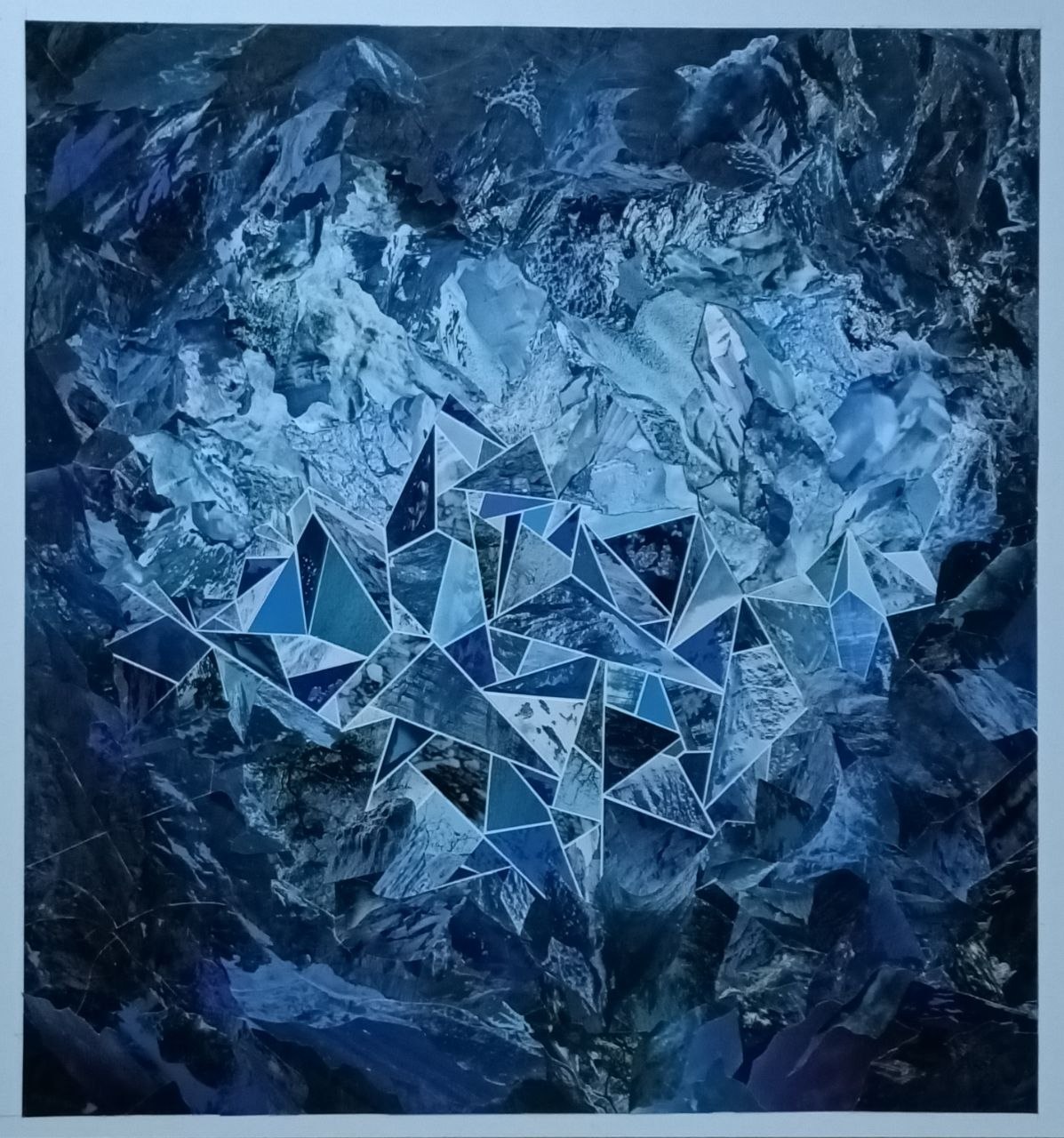 A blue geometric animal-like form emerges from a dark textured field.