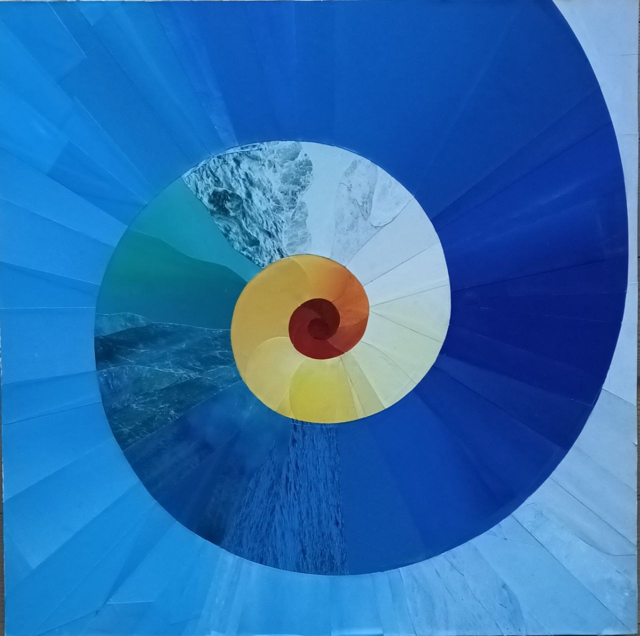 A large blue spiral turns inward toward a warm yellow and red center.