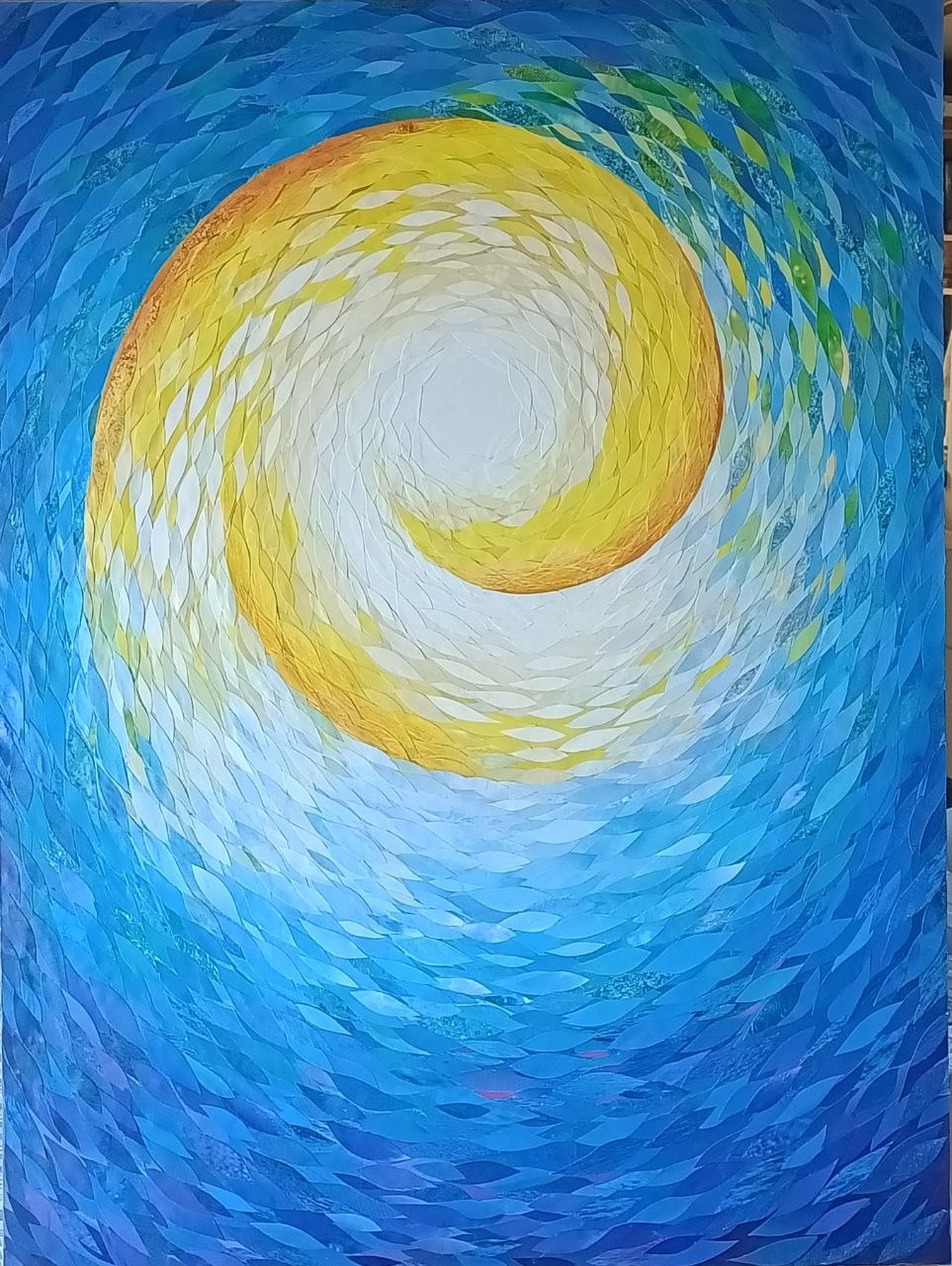 A blue and yellow spiral made of many small petal-like shapes.